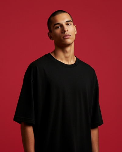 Person wearing a black t-shirt against a red background